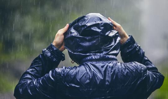 Person in water repellent coat