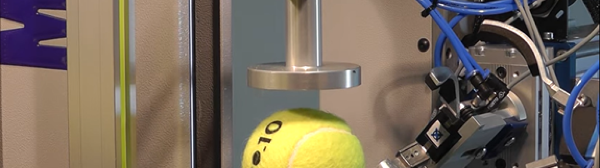 Tennis ball compression