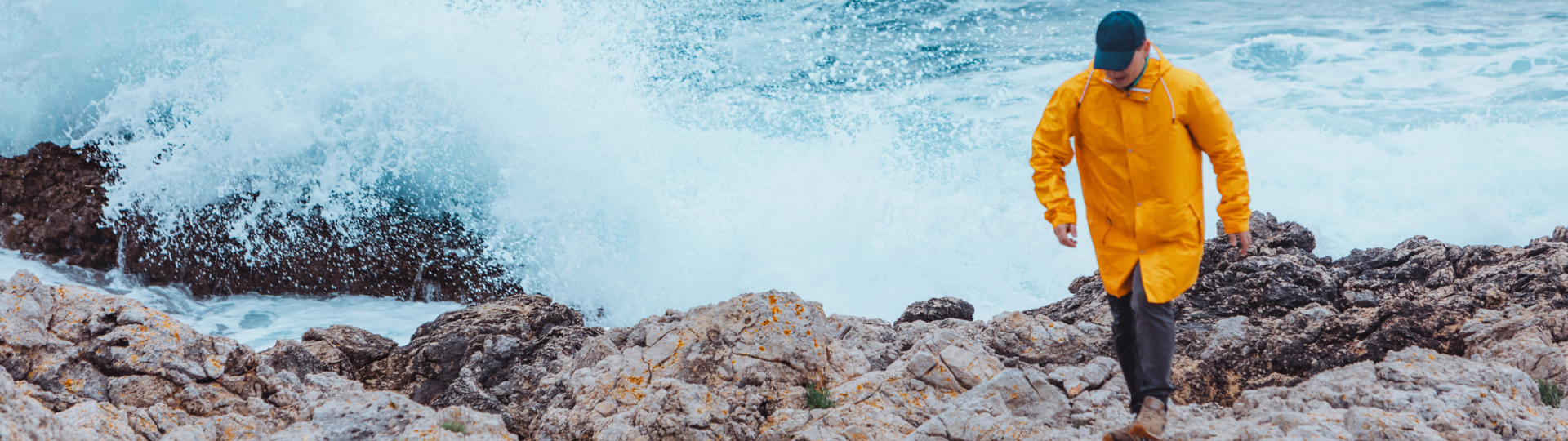 yellow raincoat sea